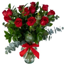 One dozen roses in glass vase
