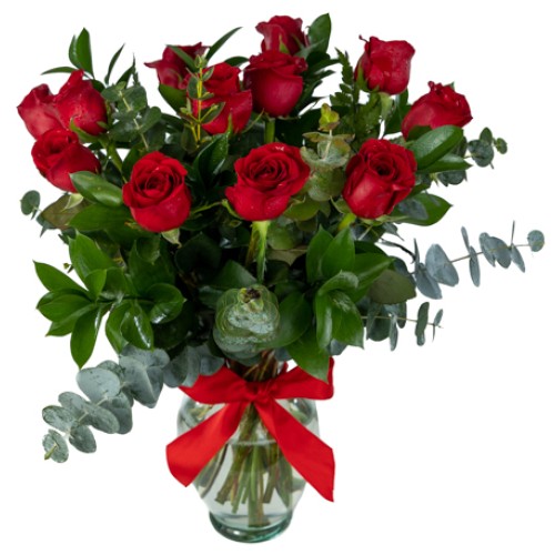 One dozen roses in glass vase