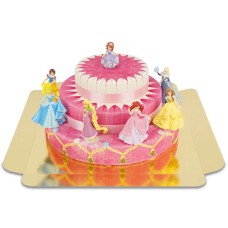 7 princesses on a three tier cake with ribbons