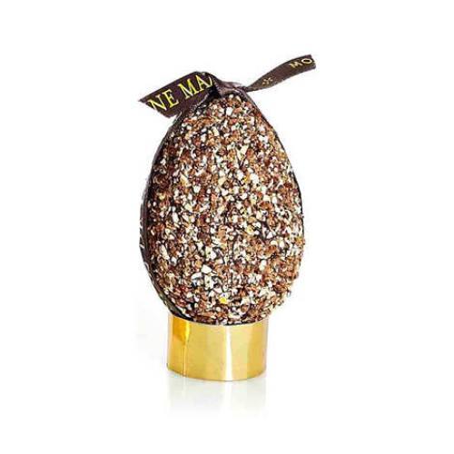 Dark chocolate egg and chunks of Praslines, garnished with eggs, figurines and Praslines