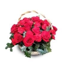 Flower arrangement of roses and carnations in a basket