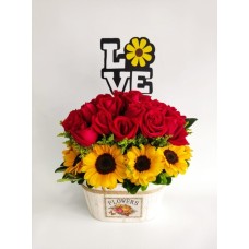 Floral arrangement with roses and sunflowers