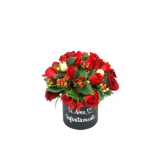 Floral arrangement with roses and ferreros