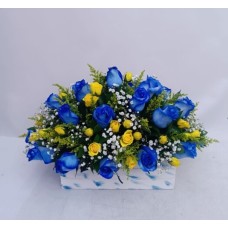 Floral arrangement with blue roses and mini roses